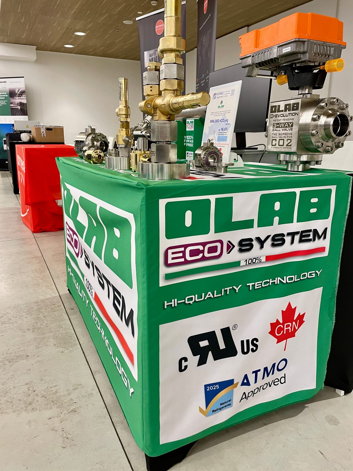 OLAB trade show stand displaying the ATMO Approved 2025 label