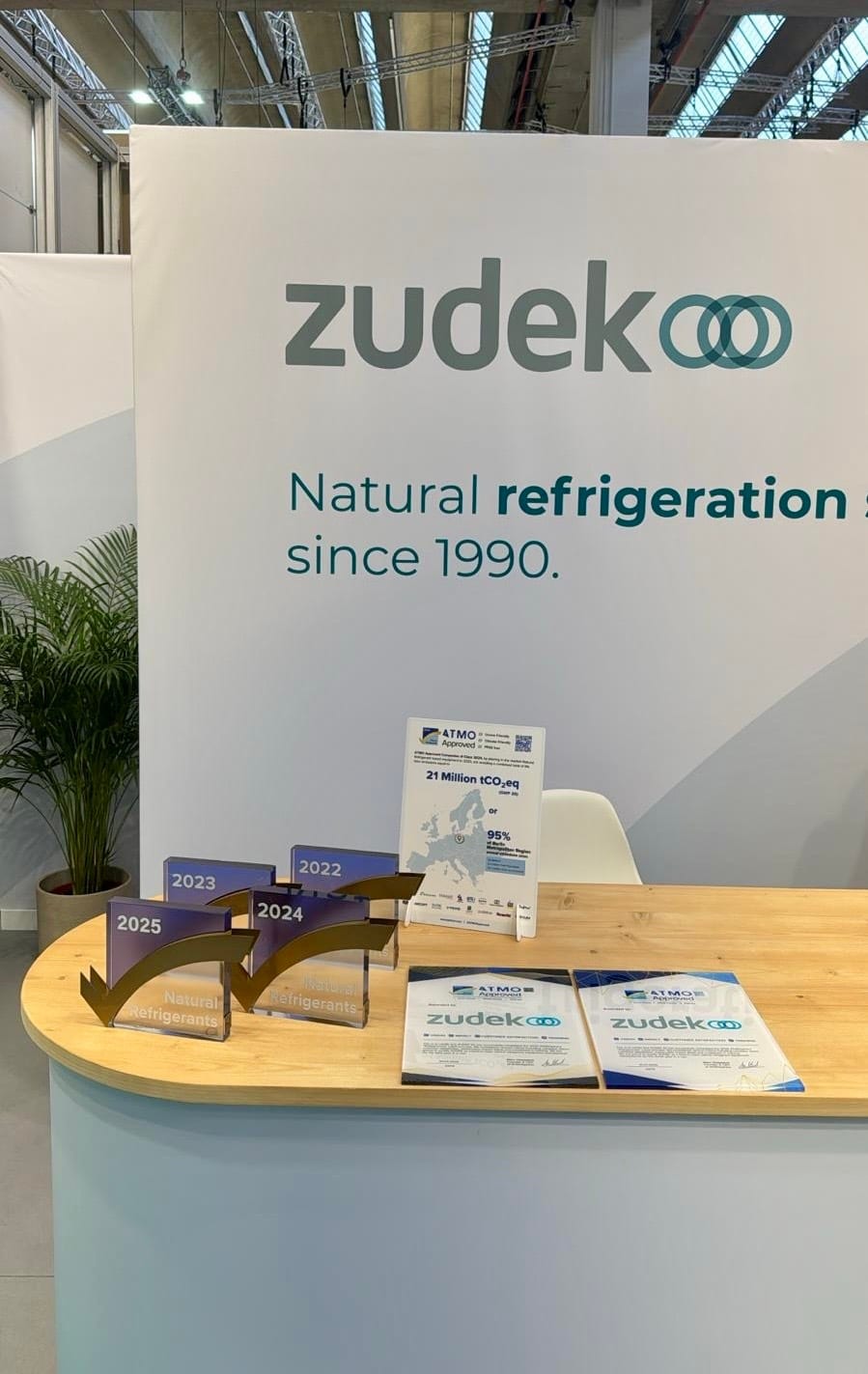 Zudek trade show booth with ATMO Approved awards and certificates
